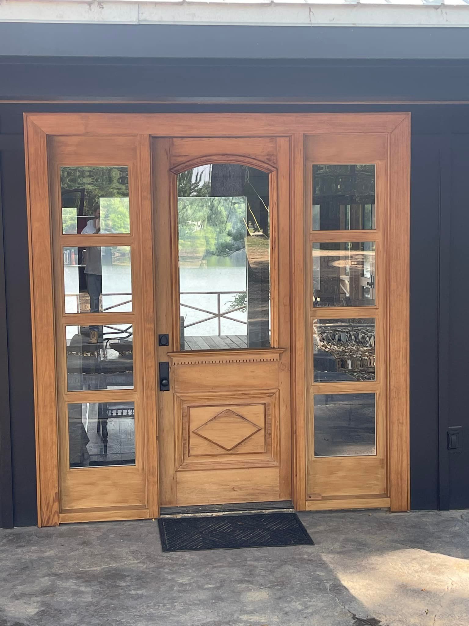 Wooden door with glass panels; entry to a building.