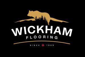 The logo for wickham flooring has a bear on it.