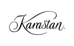 A black and white logo for karastan on a white background.