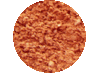 Primo piano circolare di una sostanza granulare grossolana, dalla consistenza ruvida e di colore rosso-arancio, simile a una spezia o a un condimento.