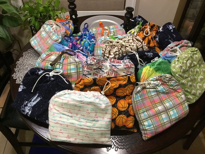 A table with a bunch of bags on it