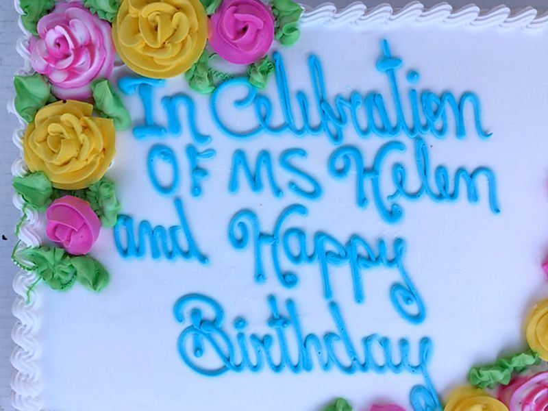 A birthday cake that says in celebration of ms helen and happy birthday