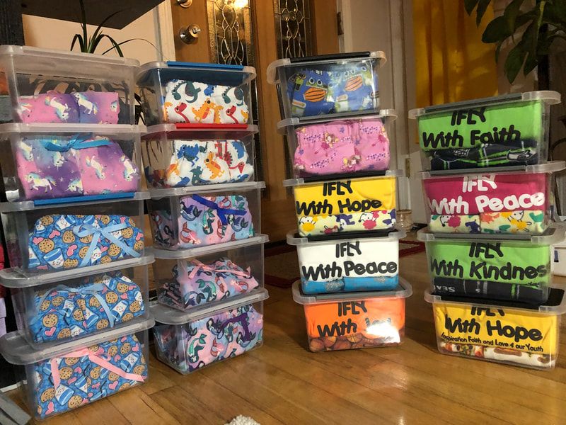 A bunch of plastic bins stacked on top of each other with the words iffy with hope written on them