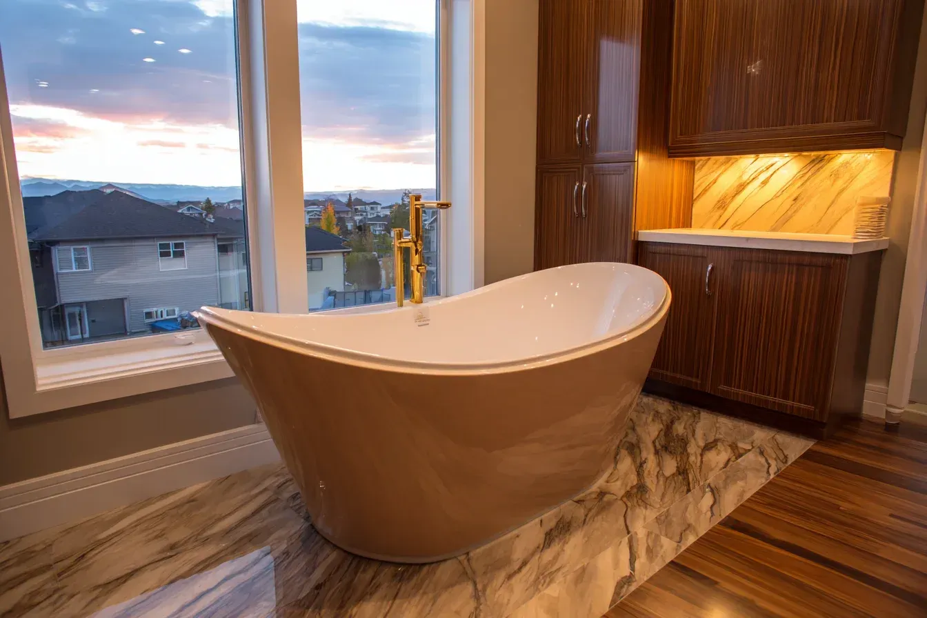 A Vancouver shower remodel featuring a frameless glass enclosure, rainfall shower head, and porcelain tile walls. Waterproofed using Schluter systems for long-term durability. A modern bathroom upgrade for homeowners across the Lower Mainland.