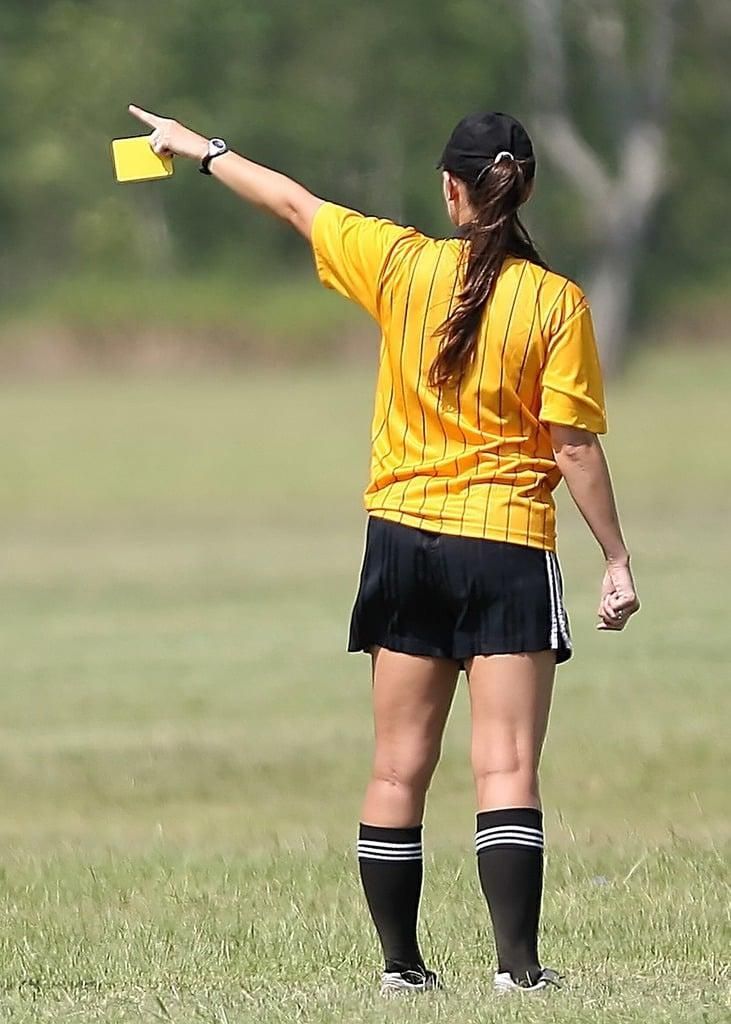 Referee displaying a yellow card