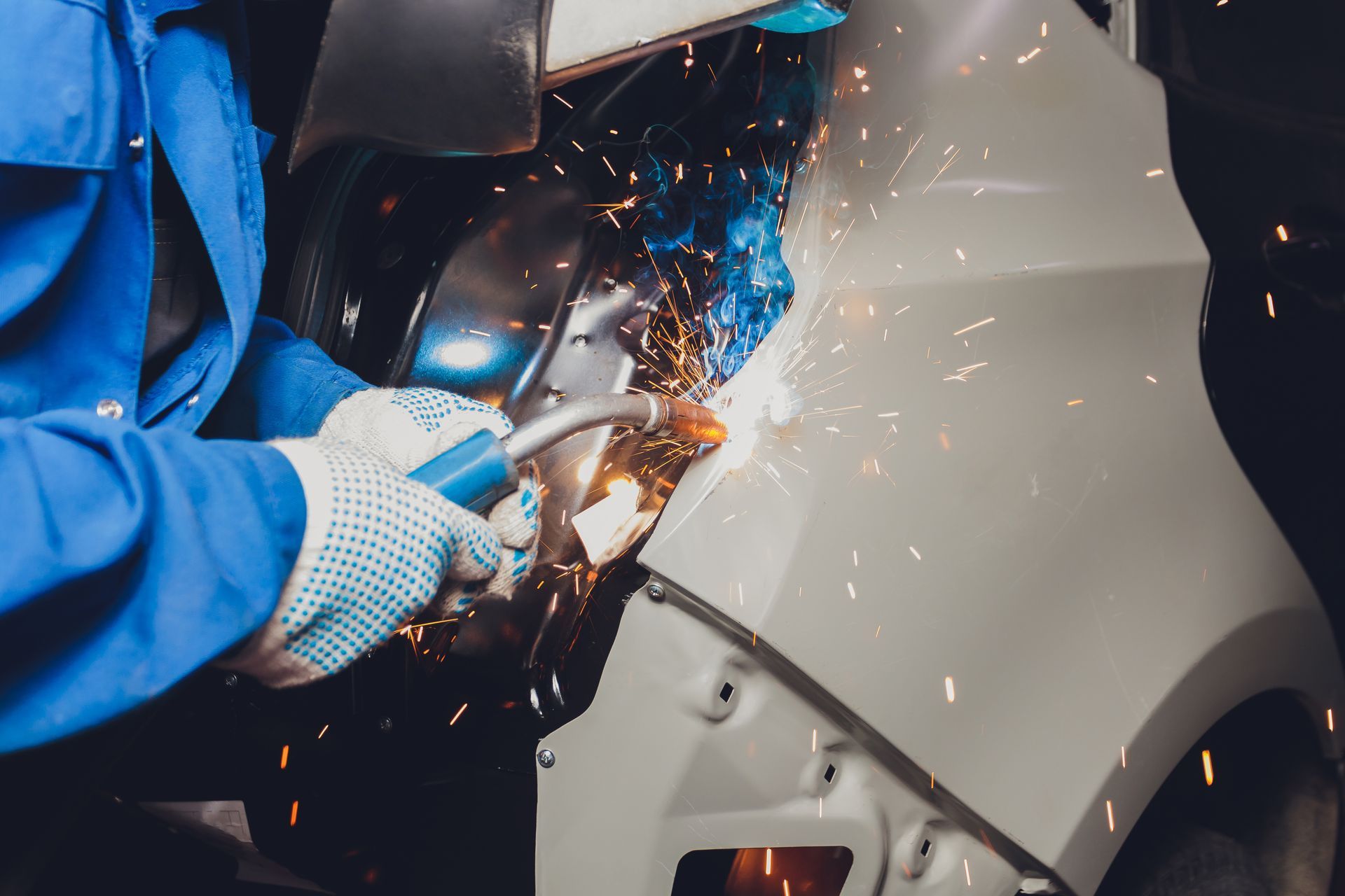 Welding a car body.