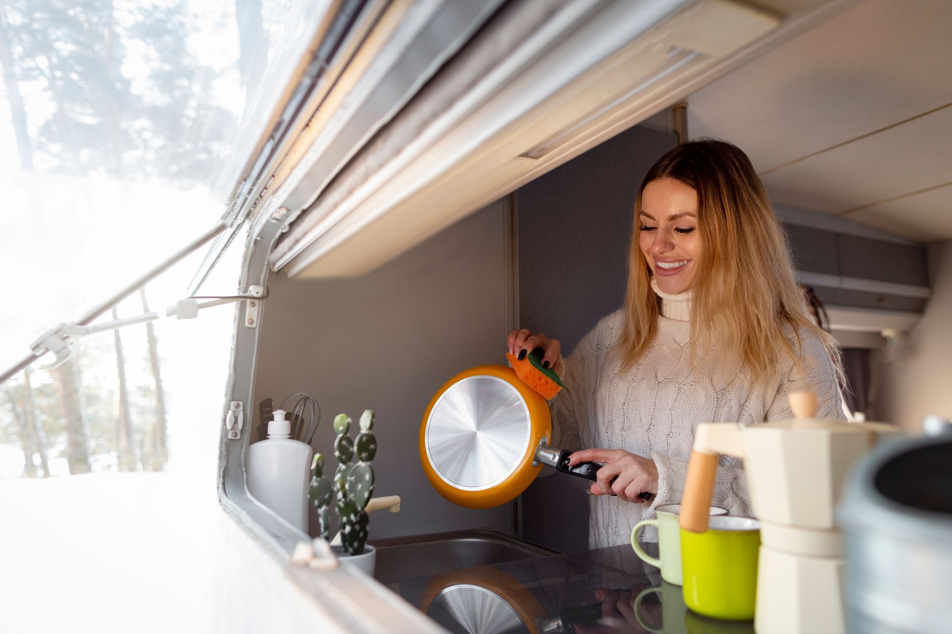 Woman washing dishes in RV
