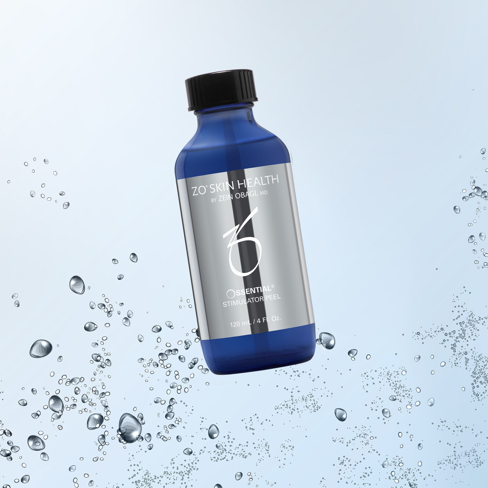 Bottle of ZO Skin Health product, blue and silver, with water droplets around it.