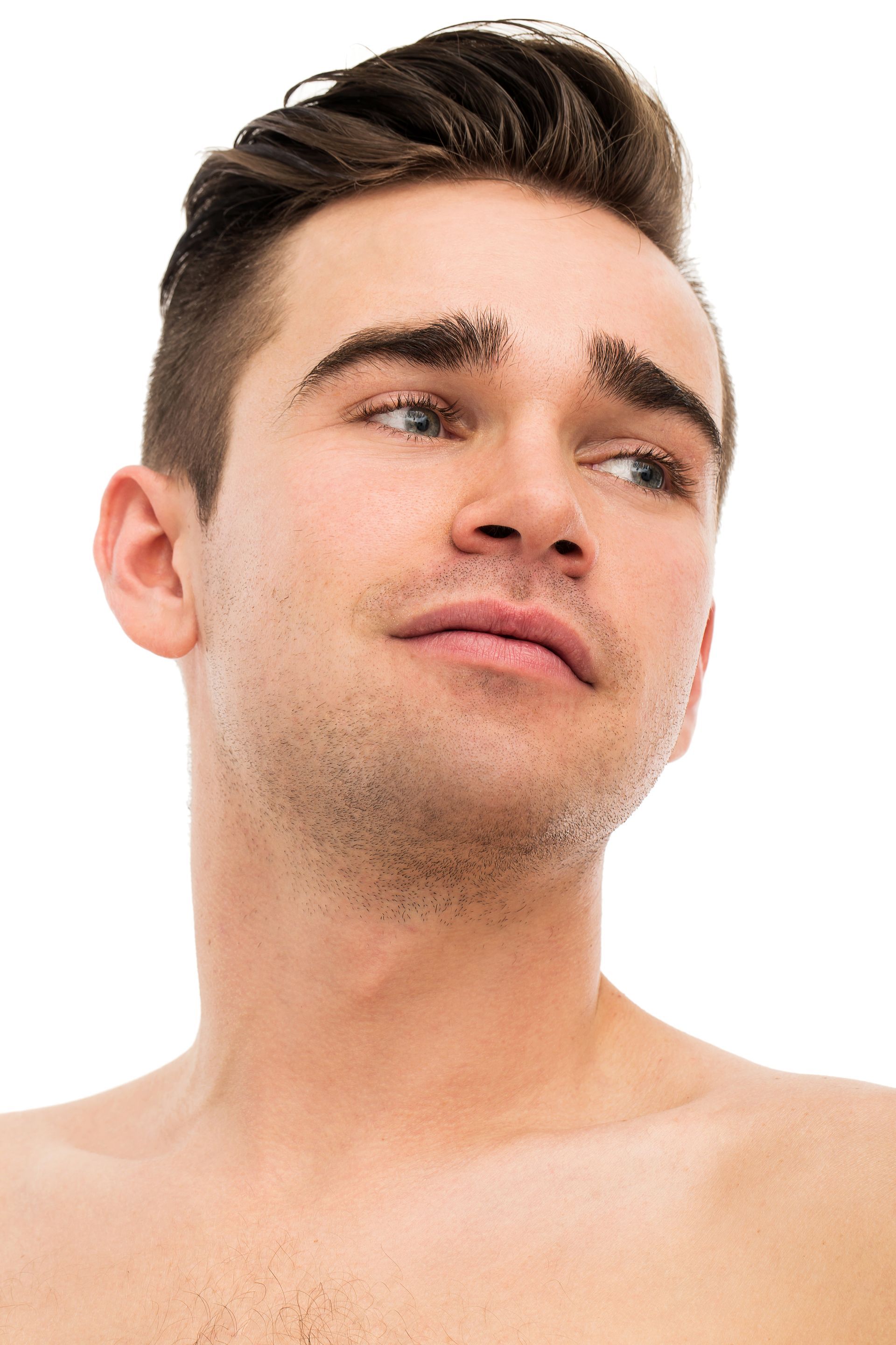 Man with dark hair, looking to the side with a serious expression. Bare chest.