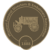 Brown circular medal/logo with a film camera icon and the year 1888 in the center.