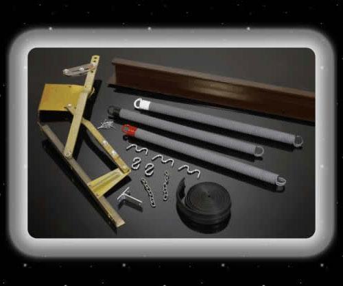 Parts of a garage door: frame, springs, hardware, and rolled-up fabric on a reflective black surface.