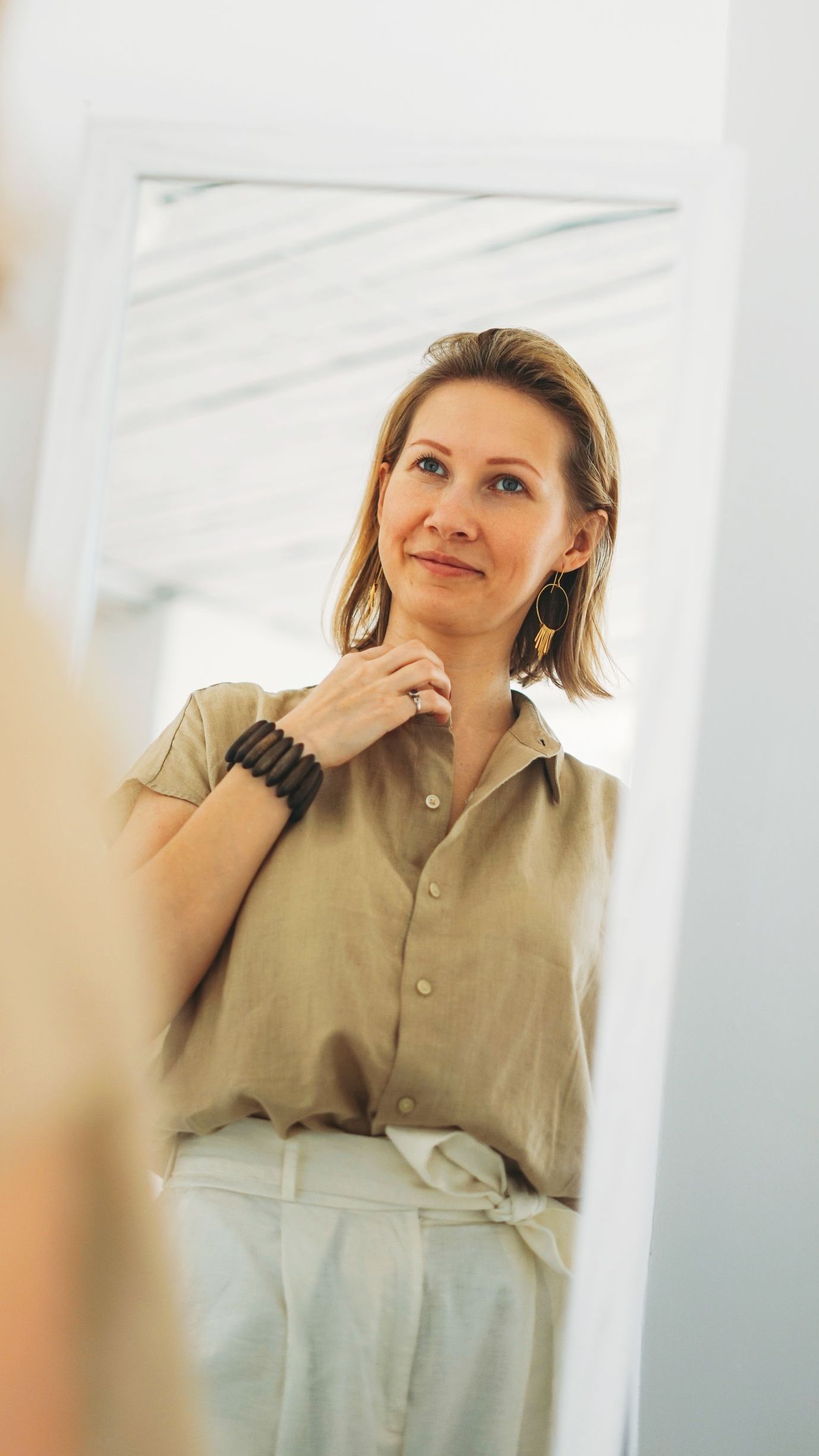 attractive woman smiling in mirror