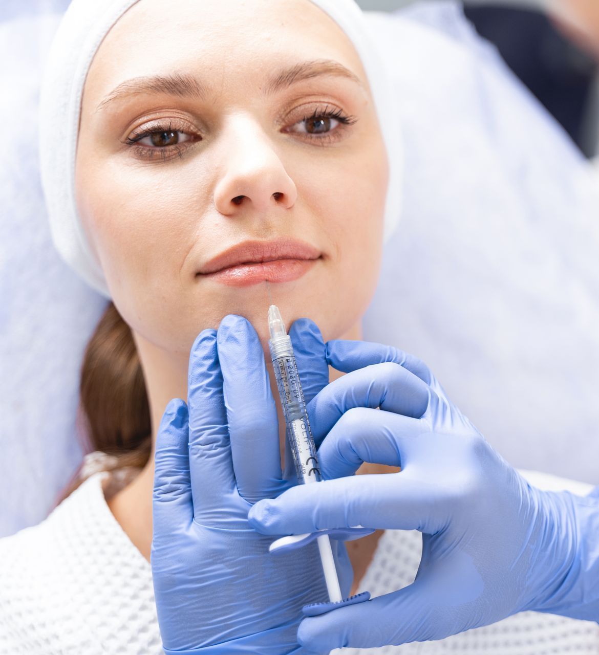 woman getting lip filler treatment