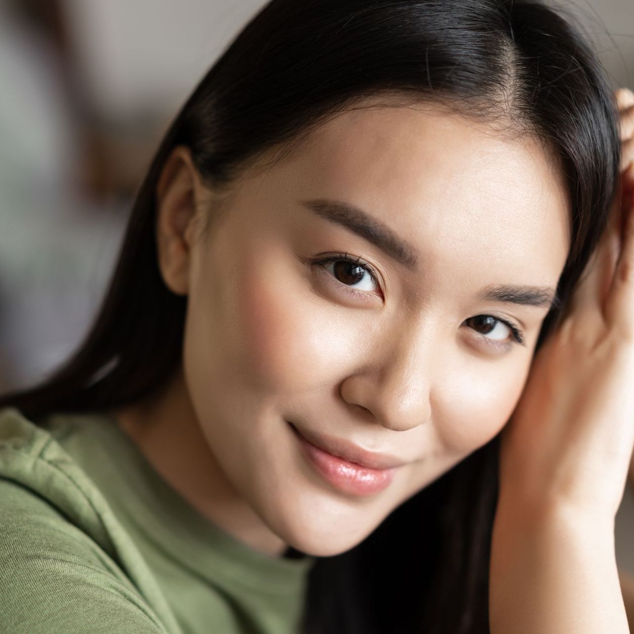 portrait of smiling asian woman with clear skin