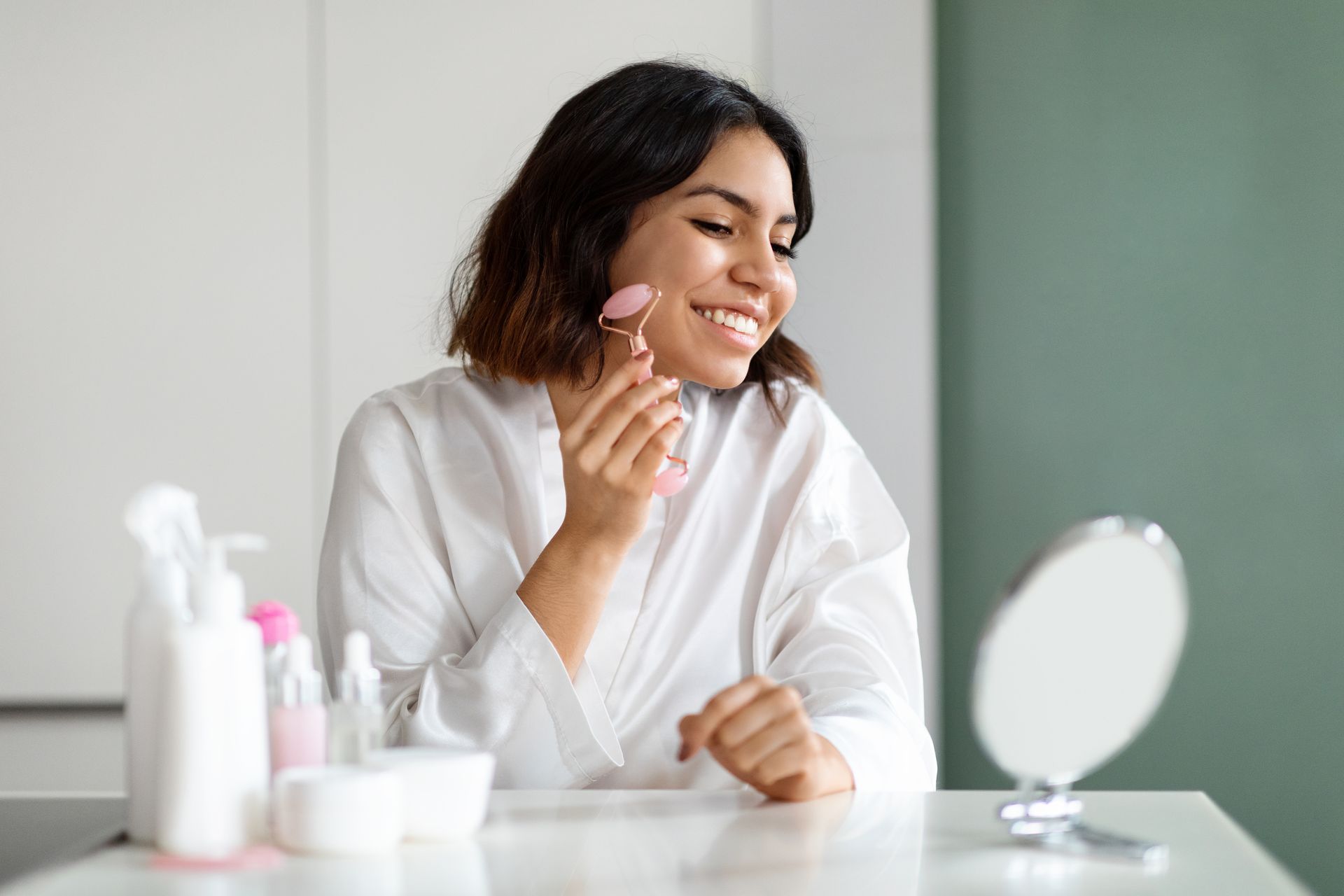 woman looking at her face in small mirror