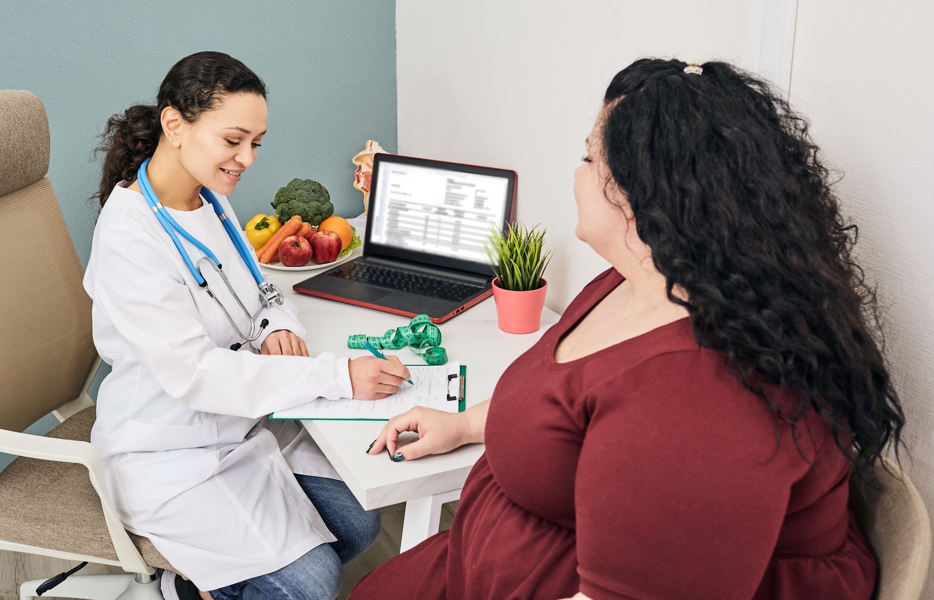Doctor showing medical chart to patient in a bright office