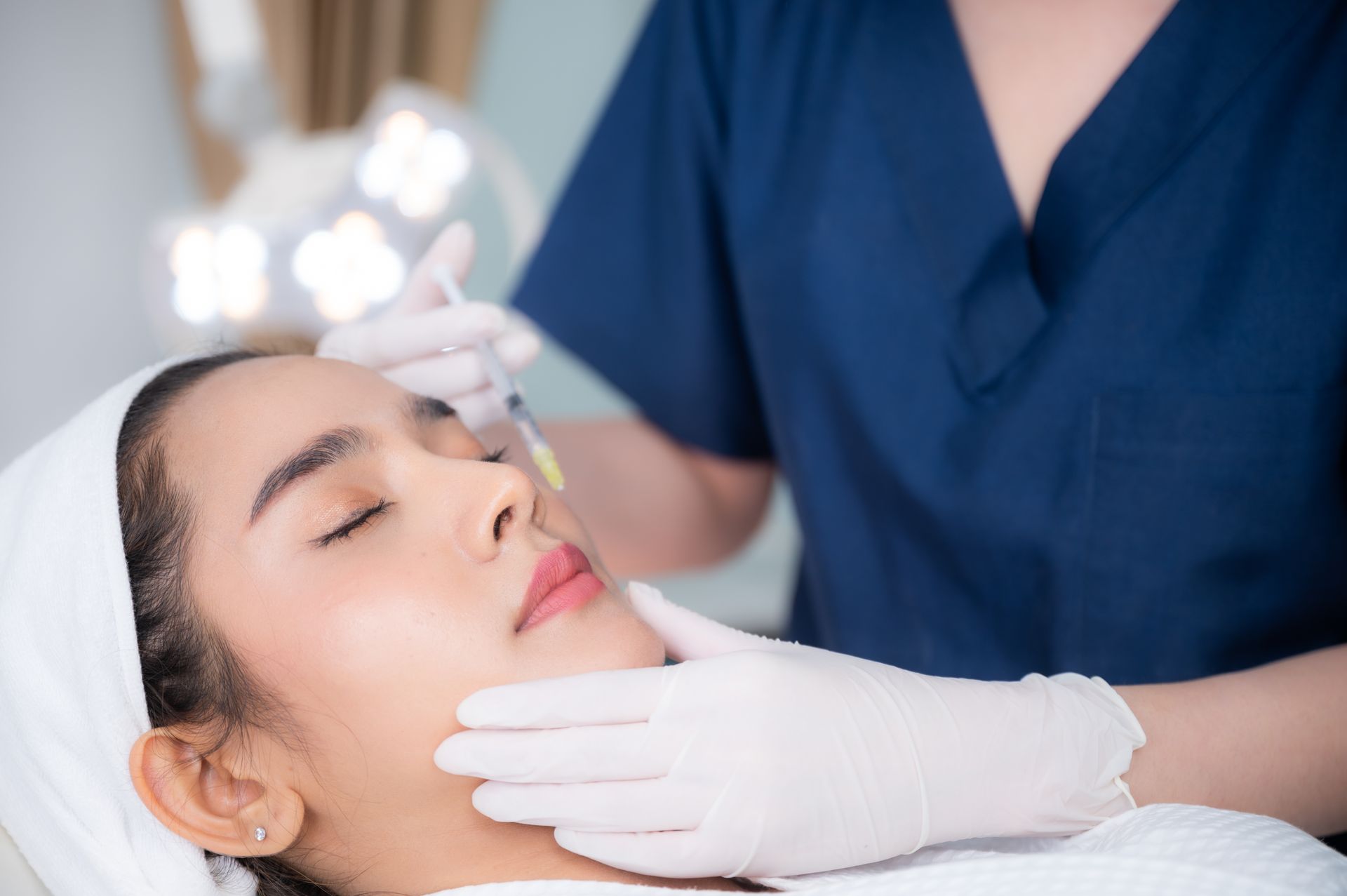asian woman getting dermal fillers