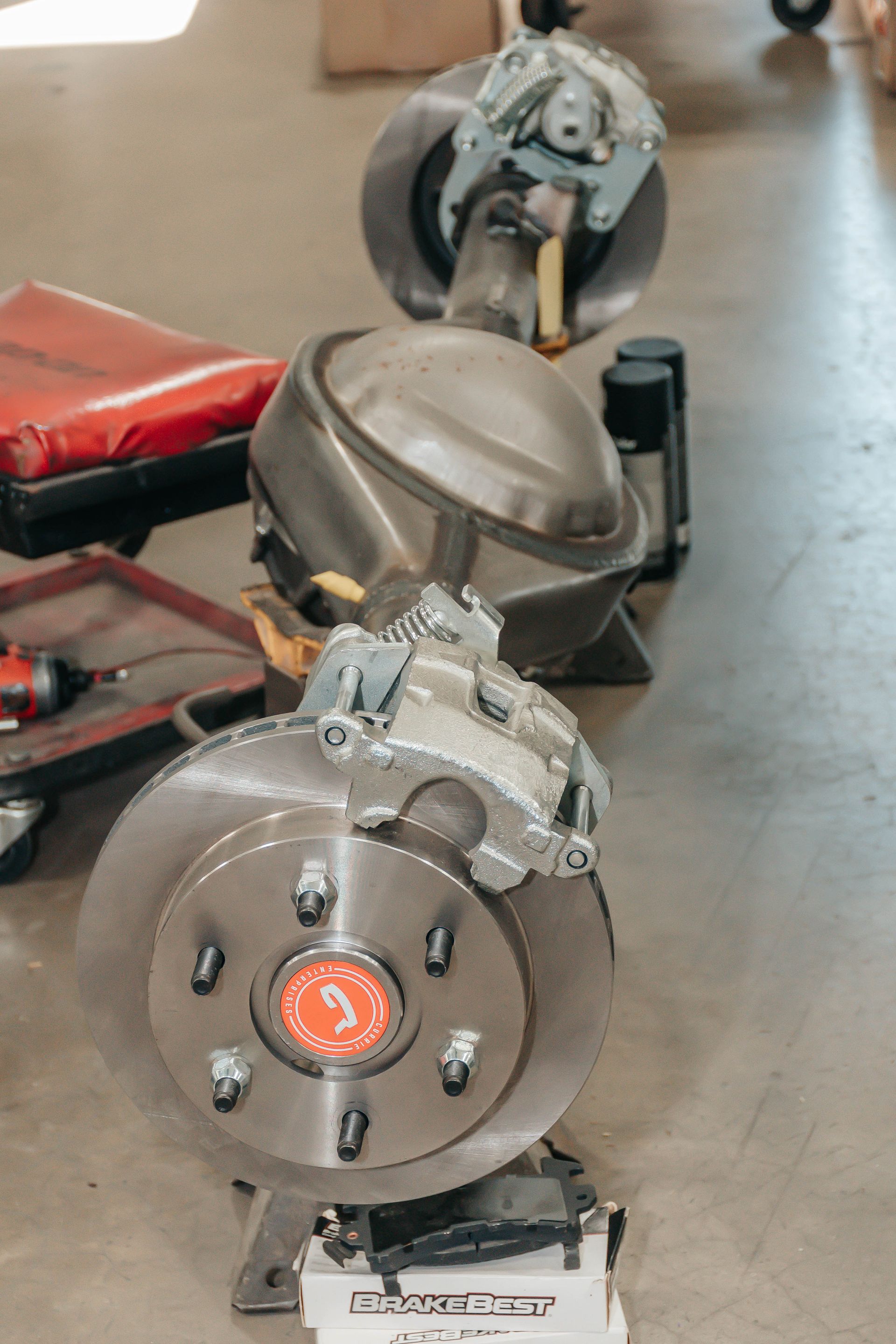 Close-up of industrial machinery with a large circular metal component in a workshop