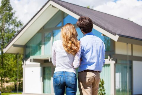 Home Loan customers outside their new home financed through Car Loans Adelaide