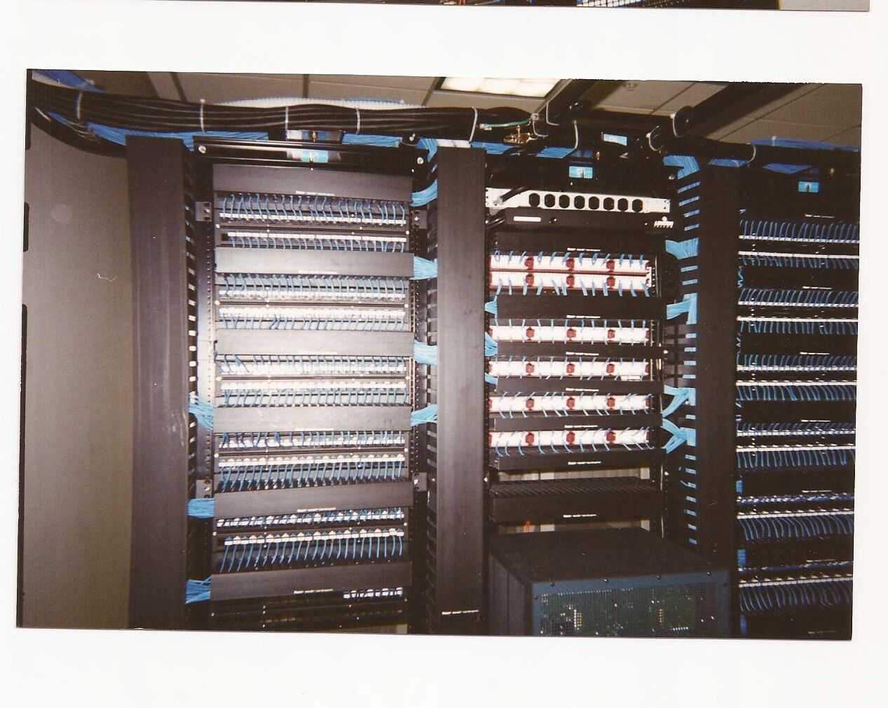 A picture of a server rack with blue tape on it