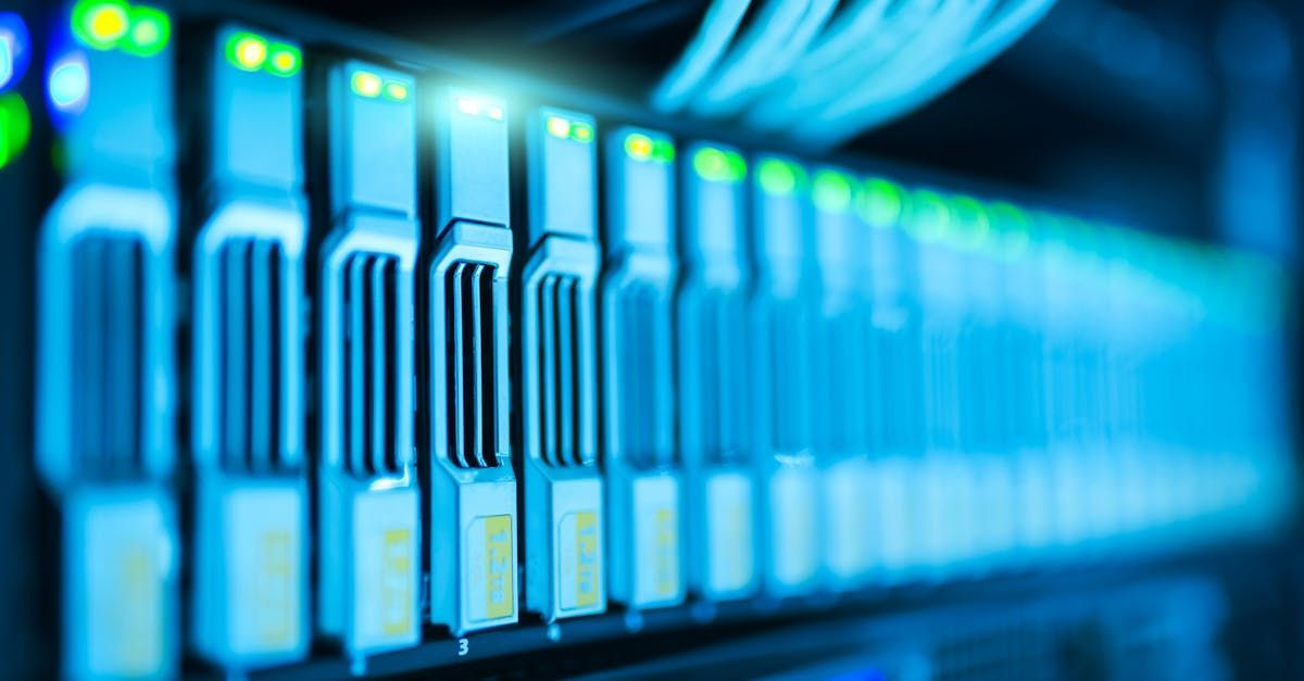 Server rack with rows of illuminated network hardware in blue tones.