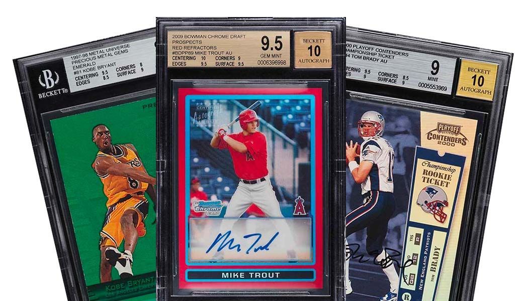 Three baseball cards are stacked on top of each other on a white background.