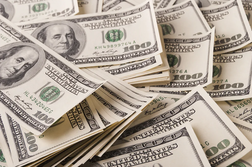 Pile of one hundred dollar bills.