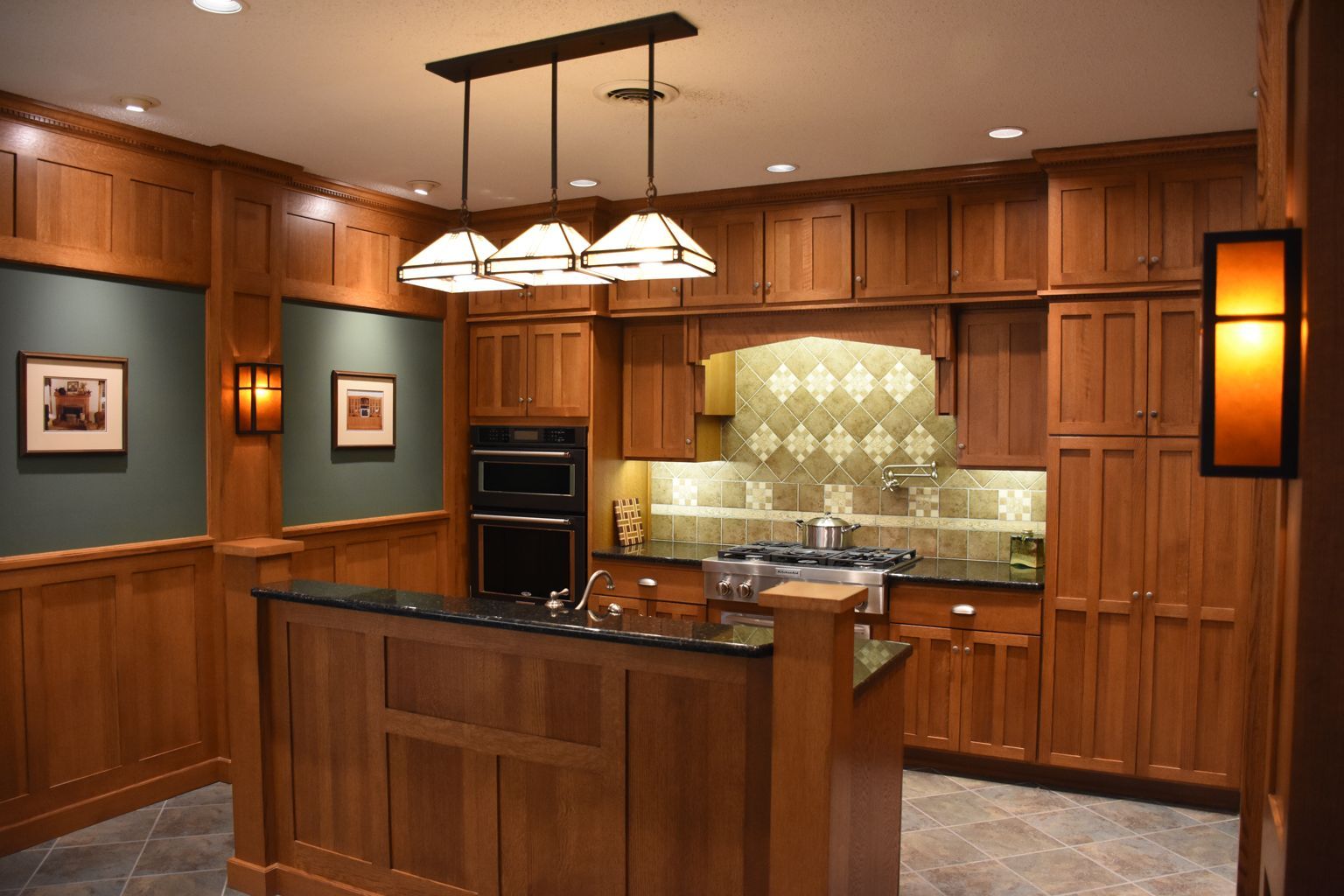 Warm wood kitchen with island, pendant lights, built-in cabinets, and tiled backsplash