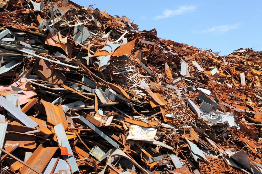 A Pile Of Rusty Metal Is Sitting On Top Of A Hill — Caloundra Scrap Metal in Landsborough, QLD