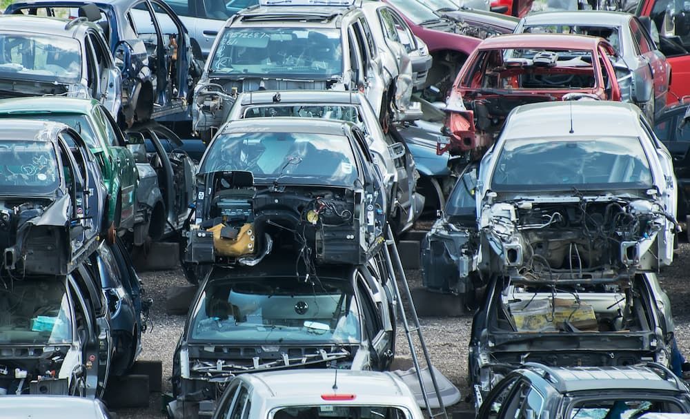 A Bunch Of Cars Are Sitting On Top Of Each Other — Caloundra Scrap Metal in Glass House Mountains, QLD