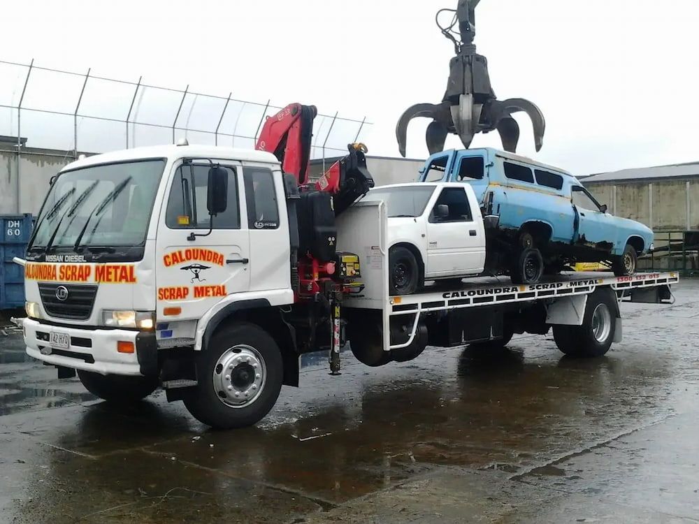 A California Scrap Metal Truck Is Carrying Two Cars — Caloundra Scrap Metal in Landsborough, QLD
