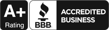 A black and white logo for an accredited business