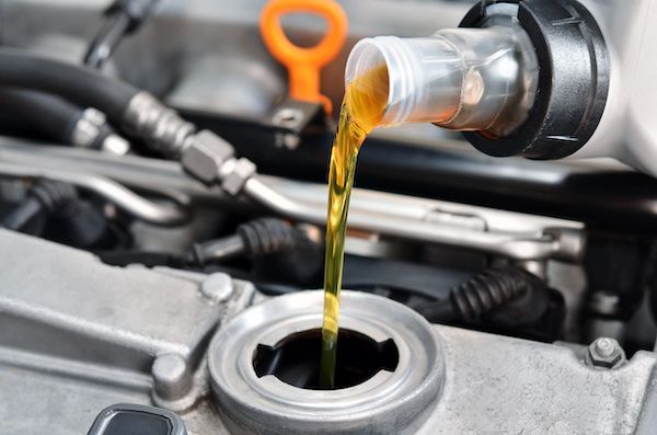 Pouring Oil | Grahams Auto & Truck Clinic