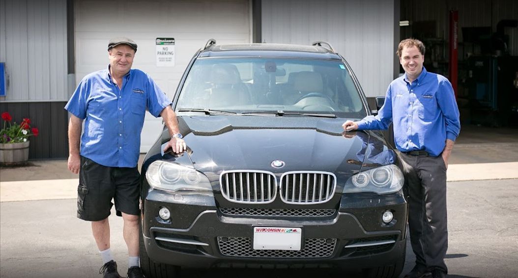 man near car | Grahams Auto & Truck Clinic