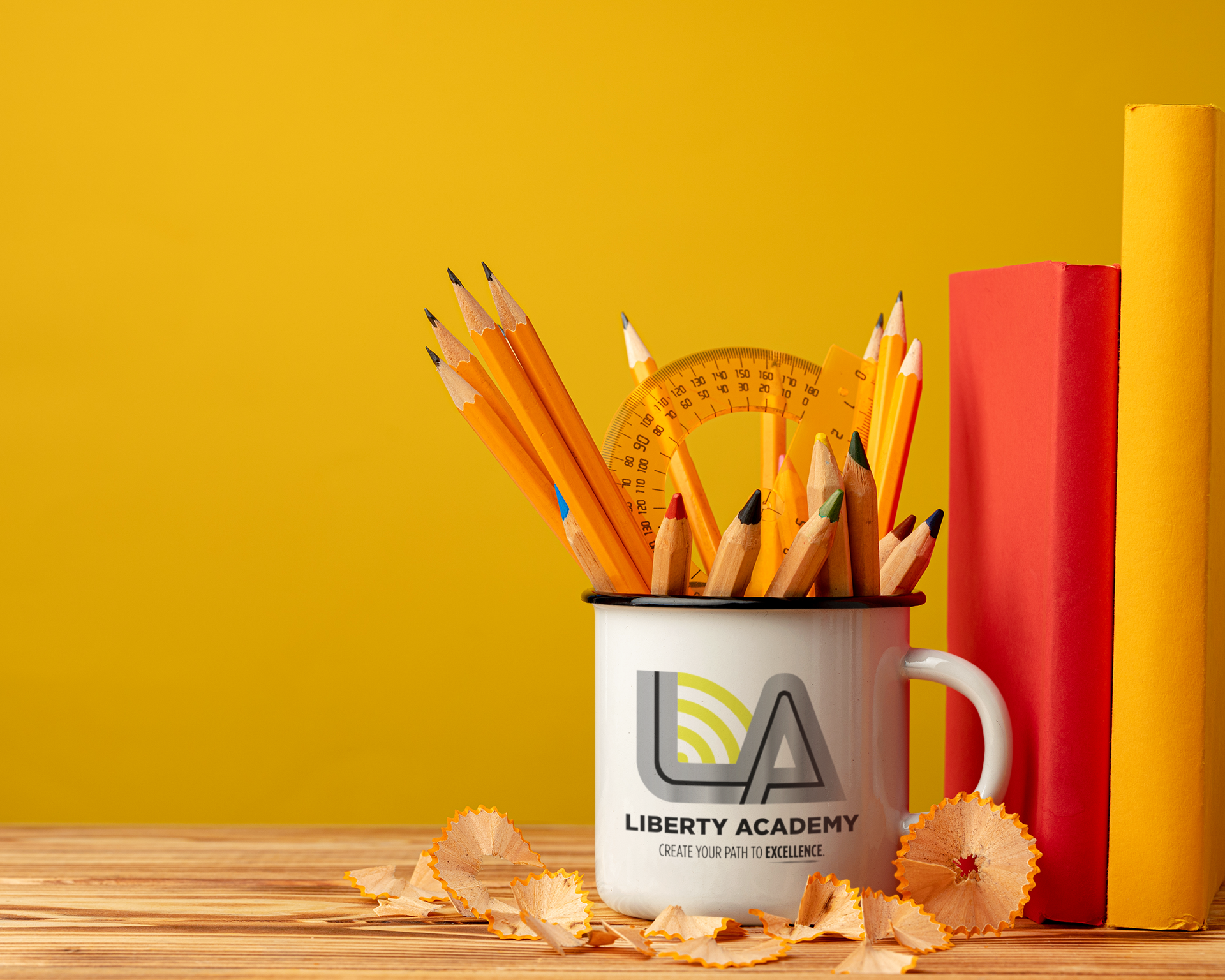 A white mug printed with the Liberty Academy logo and tagline