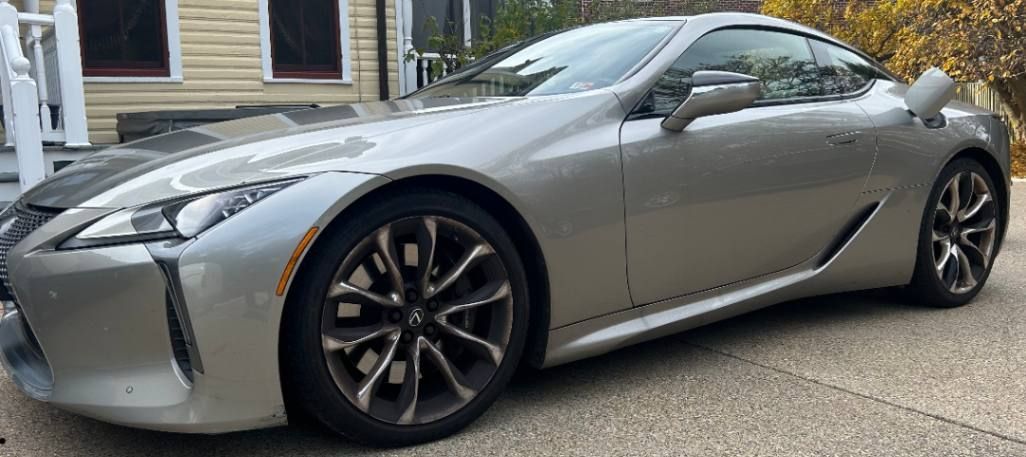 Lexus LC 500 grand tourer with smooth gloss, clean lines, and detailed wheels.