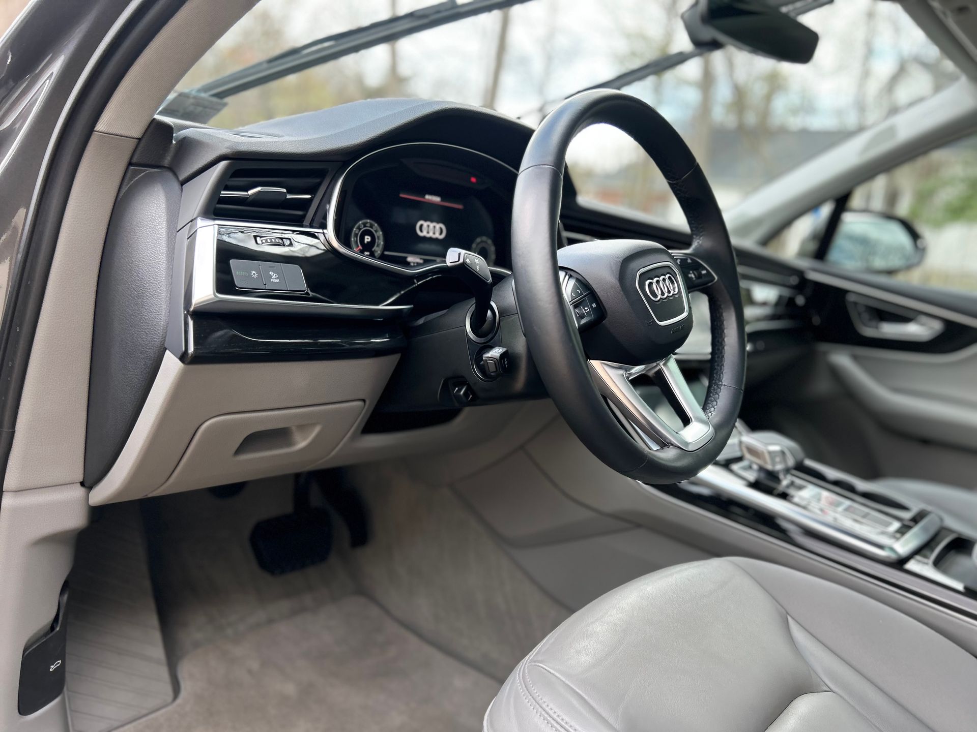 Audi virtual cockpit interior after detailing with clean fabric seating and controls.
