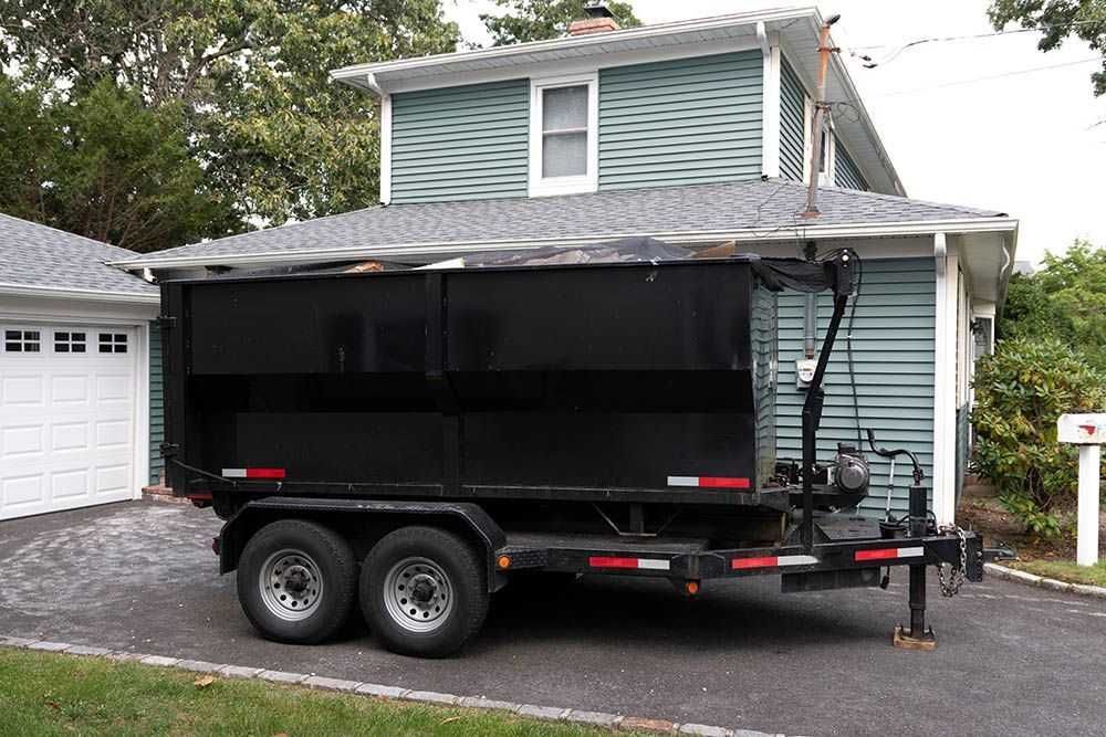 Big Tex dump trailer cleaned off the steel side walls and rear gate.