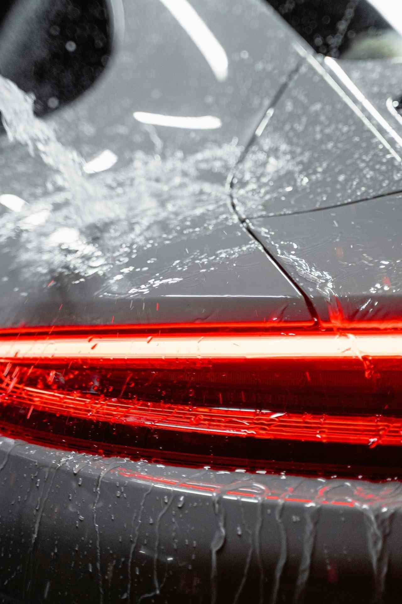 Tail light after it just rained on car that looks brand new paying with a car detailing gift card.