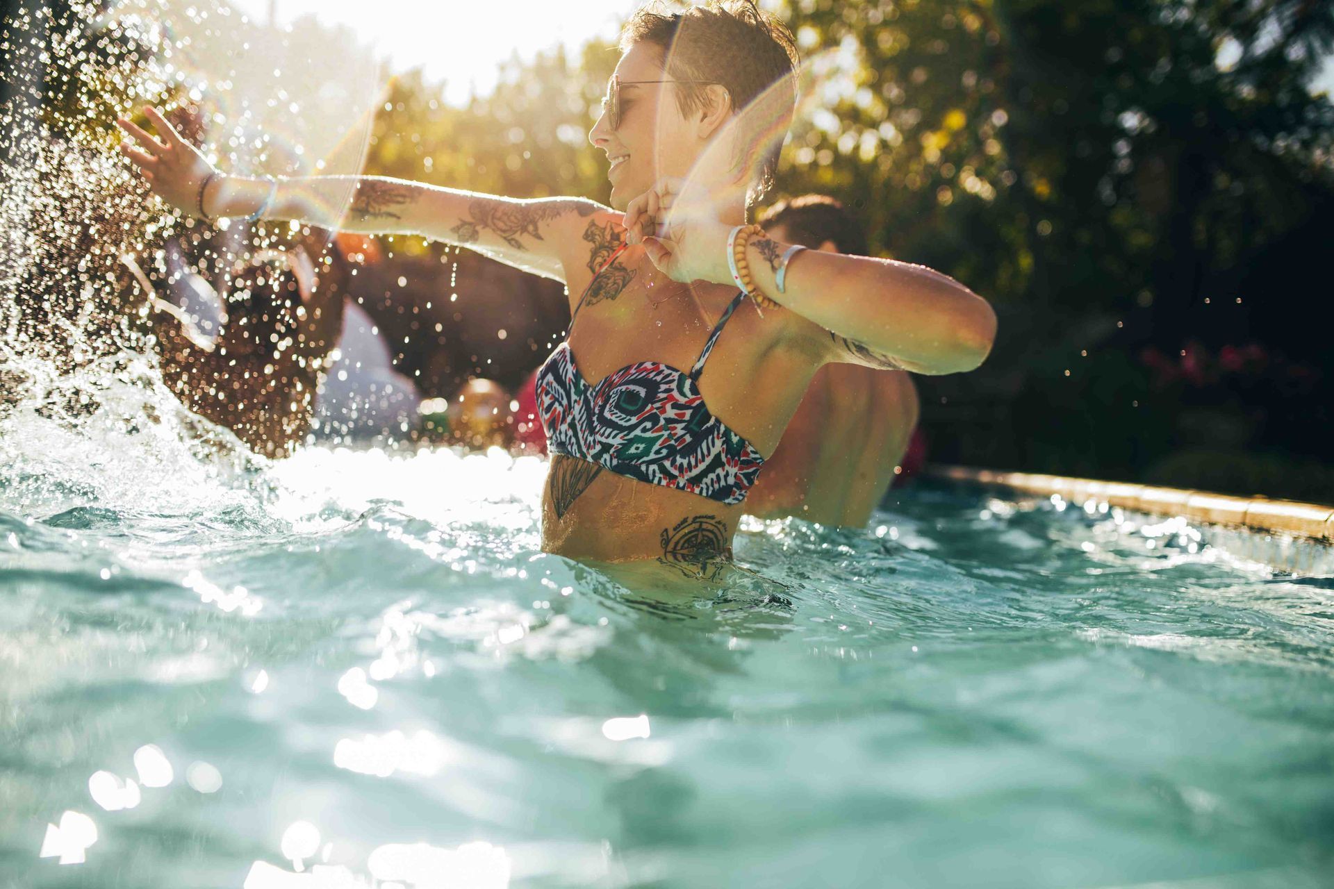 People splashing around having fun in a pool