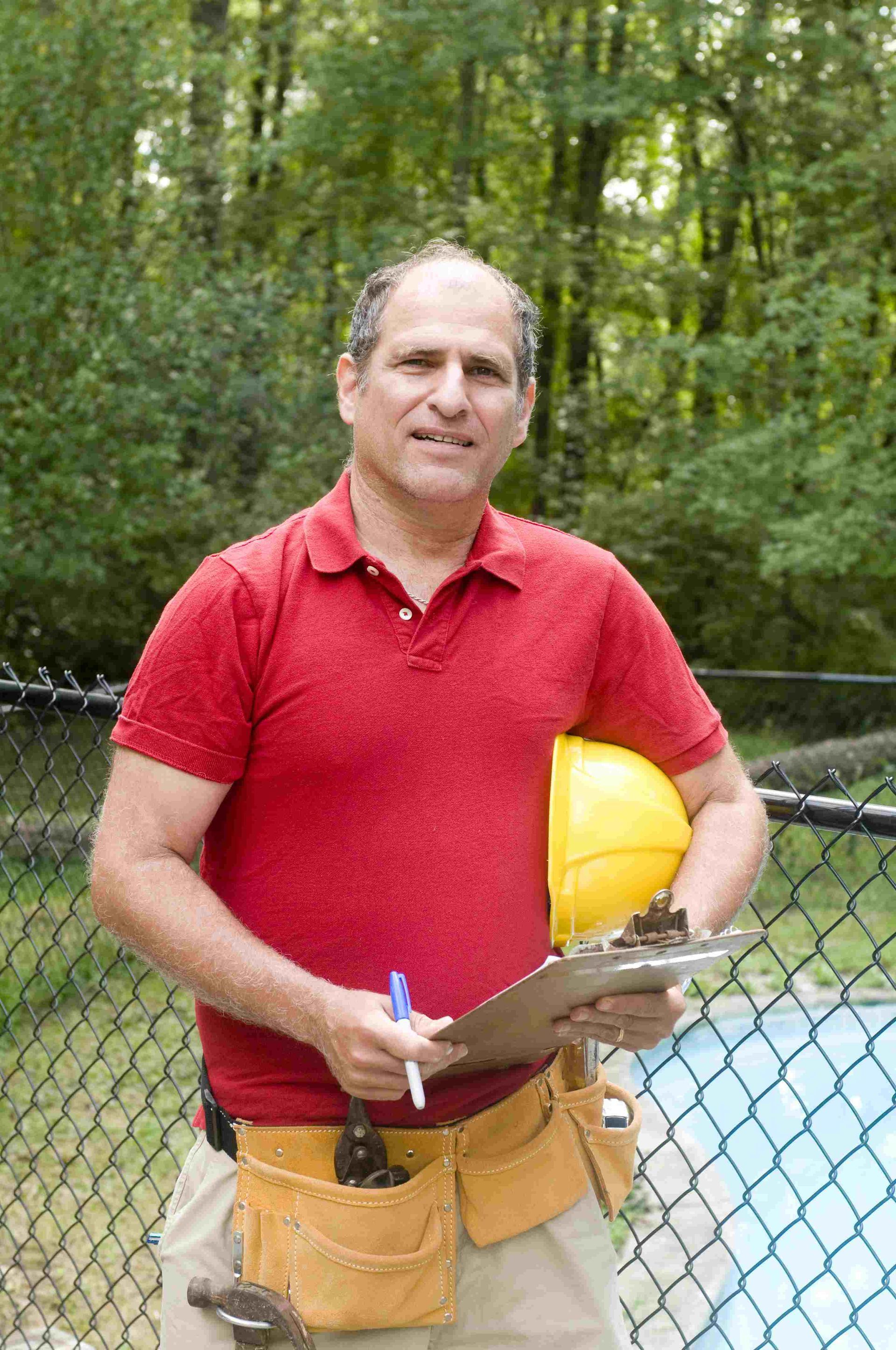 Carl Tanner taking pool-building notes for his next job