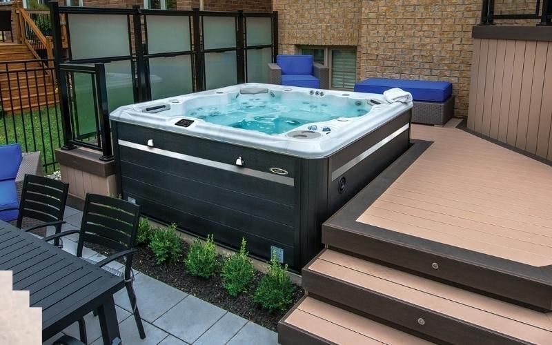 steps going up to a deck with hot tub on it