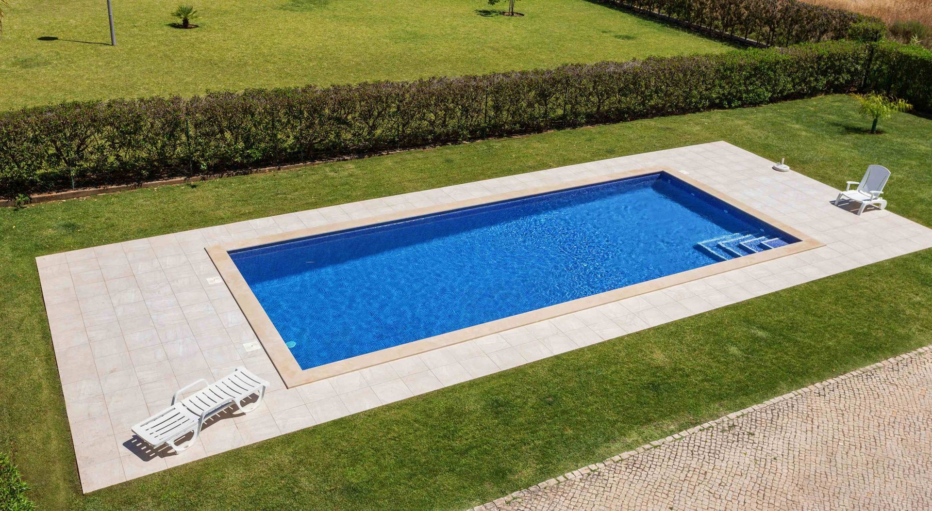 A pool in a person's backyard