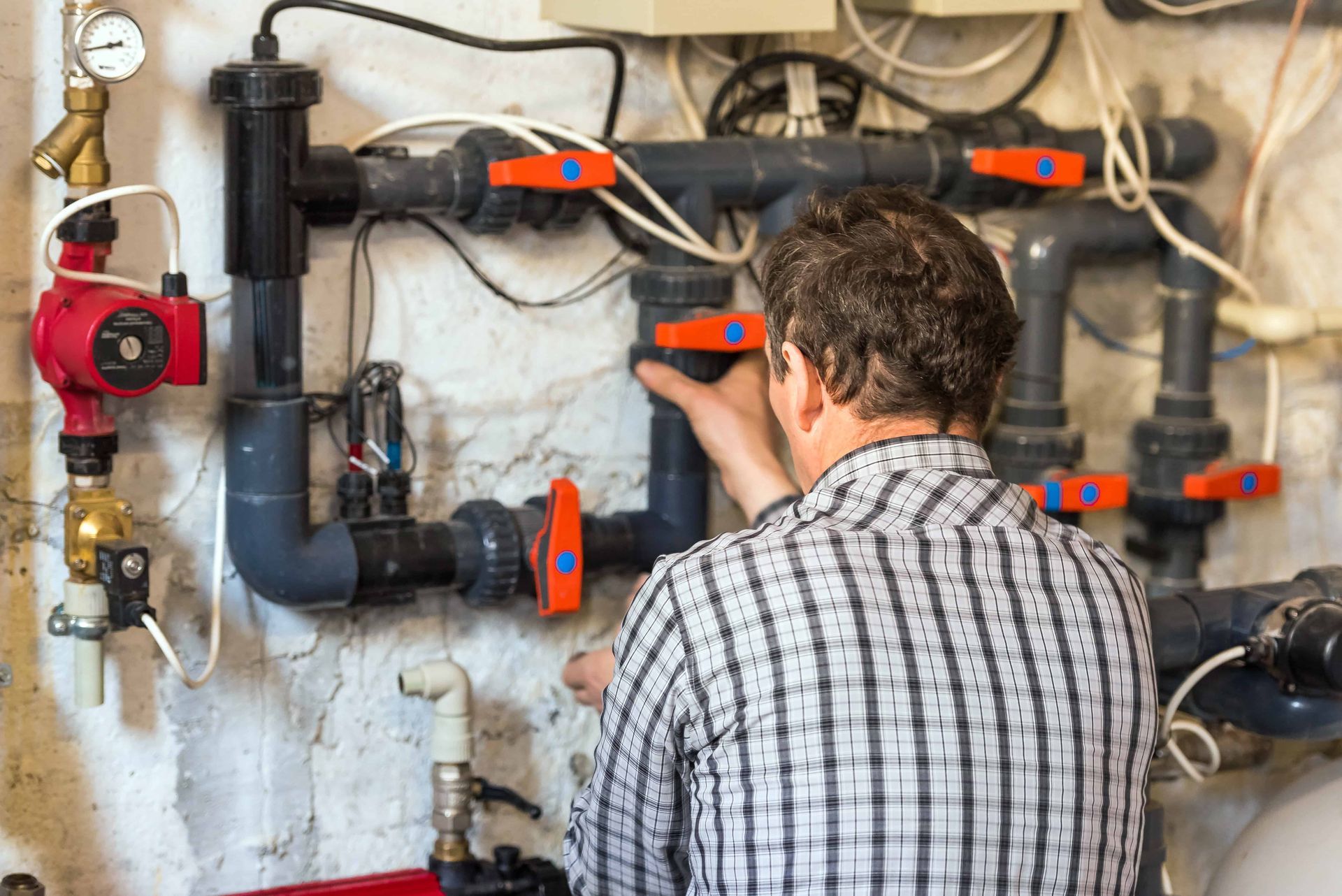 A man checking pool systems