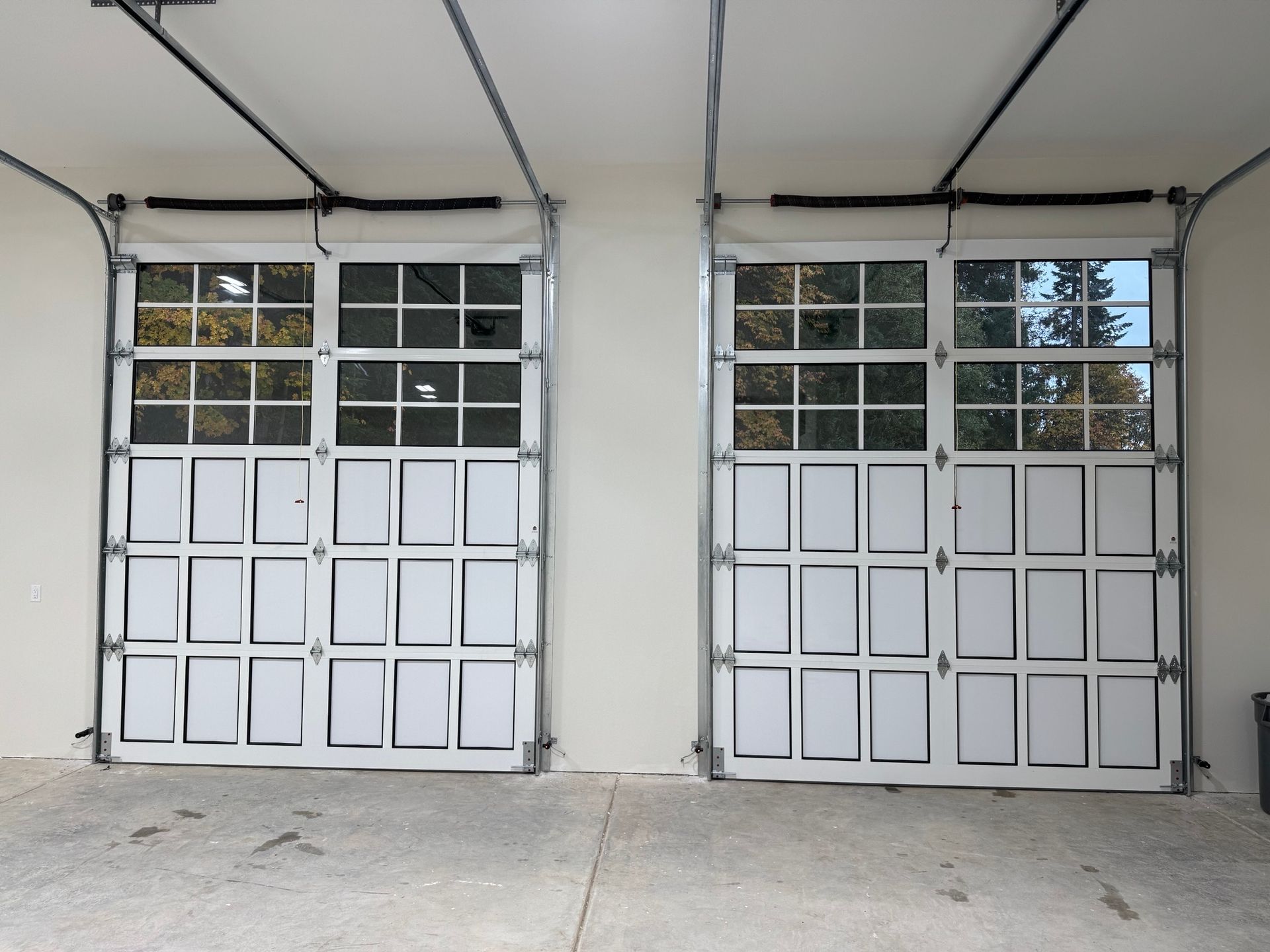 A person is using a remote control to open a garage door.