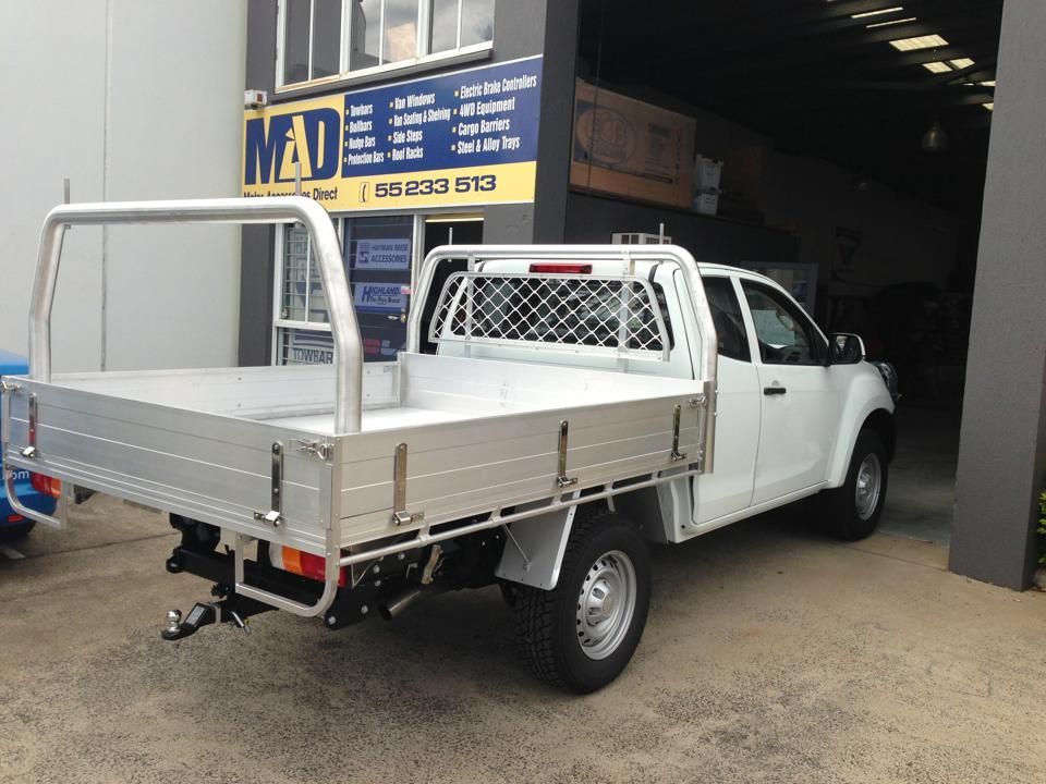 White Truck With a Silver Tray Back, Parked in Front of a Shop — Motor Accessories Direct In Tweed Heads, NSW