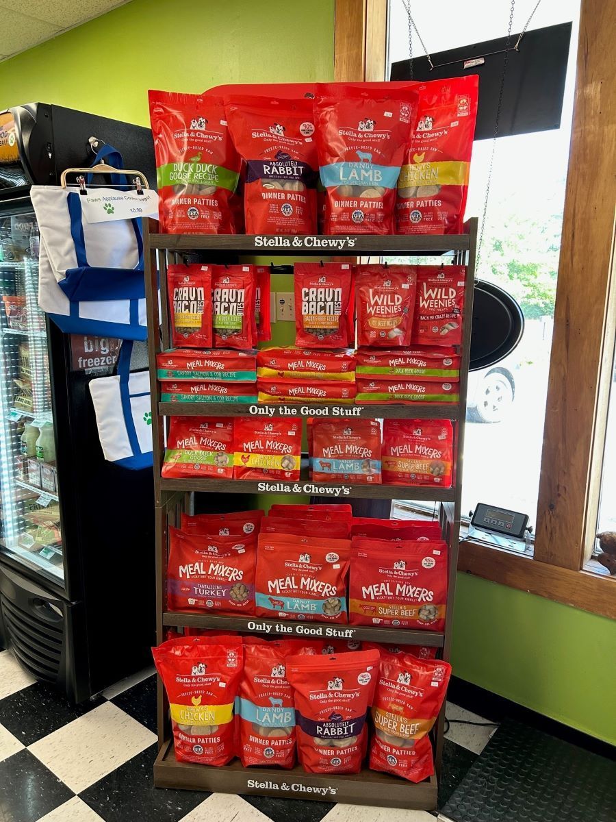 A shelf filled with bags of chips in a store.