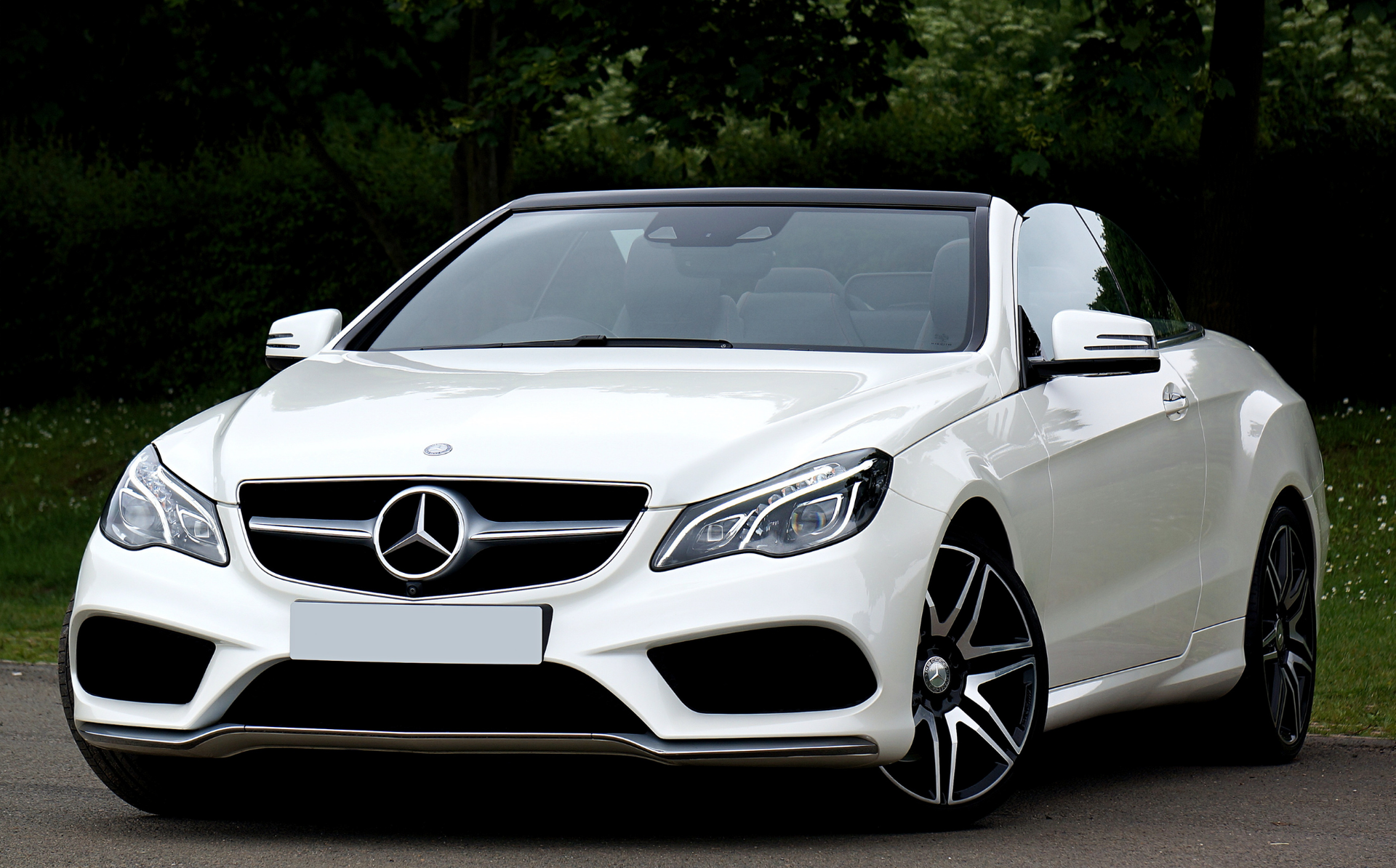 White Mercedes-Benz convertible parked outdoors