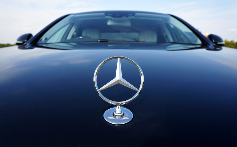 Front view of a black Mercedes-Benz with the hood ornament centered