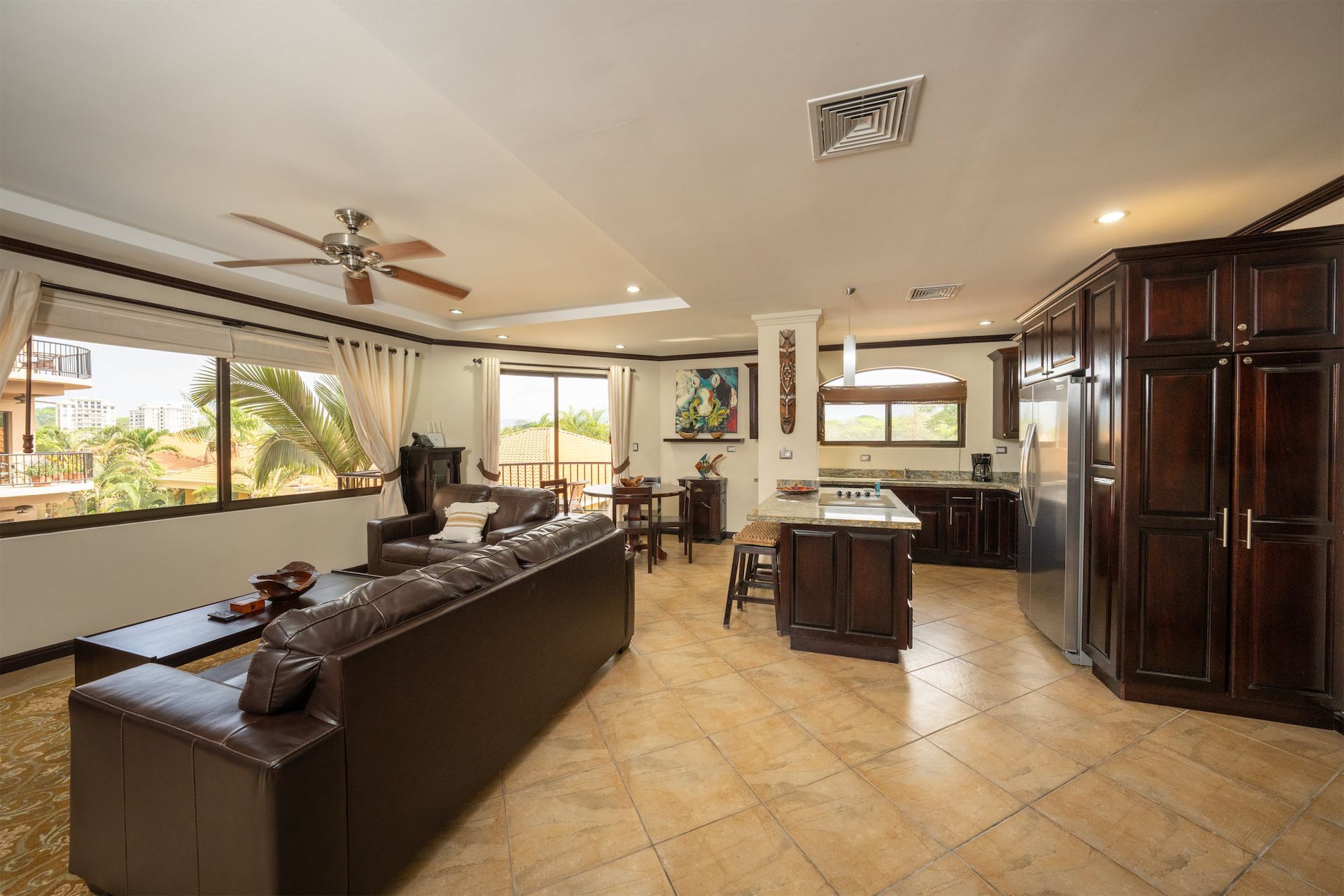 A living room with a couch and a ceiling fan